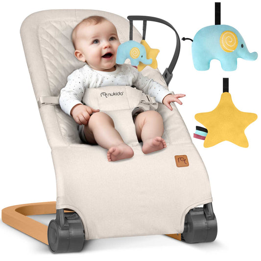 Smėlio spalvos supamasis kūdikio krėslas su žaislais Nukido su reguliuojamu atlošu ir nuimamu žaislų lankeliu